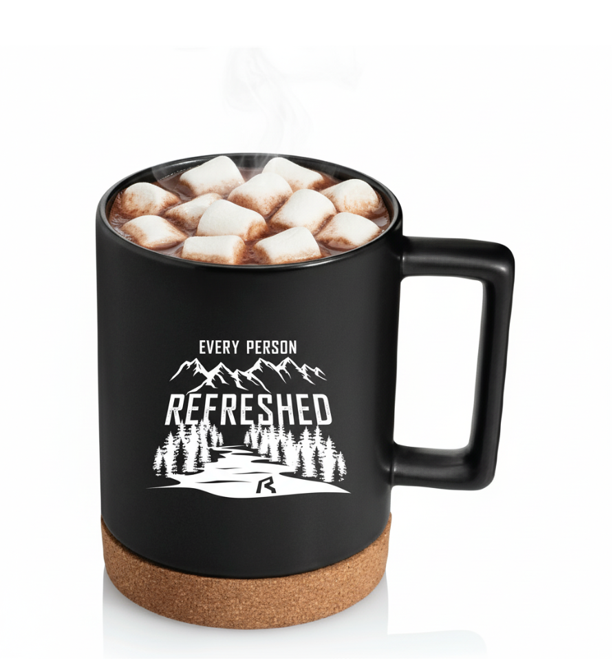 Black mug with cork base and mountain design, featuring text 'Every Person Refreshed'.